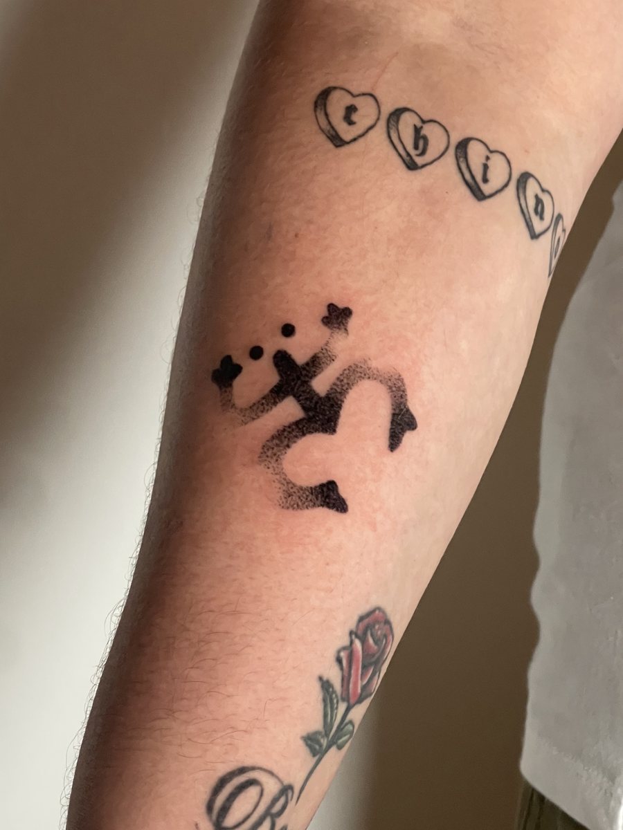 Taíno coquí hand poke tattoo with stippled shading on a forearm, Puerto Rico