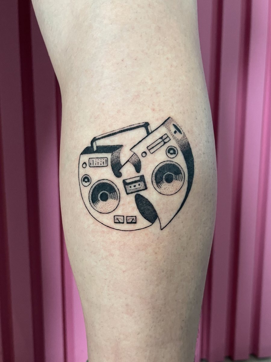 Custom Wu-Tang radio hand poke tattoo, black dotwork on a calf, Puerto Rico